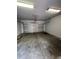 Spacious garage with an automatic door, offering secure parking and additional storage at 14531 Pleach St, Winter Garden, FL 34787
