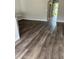 Open living room boasting durable laminate flooring and views of the entry at 14531 Pleach St, Winter Garden, FL 34787