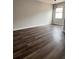 Spacious living room with hardwood floors and natural light at 14531 Pleach St, Winter Garden, FL 34787