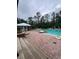Relaxing community pool featuring a spacious sun deck with lounge chairs at 14531 Pleach St, Winter Garden, FL 34787