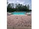 Resort-style swimming pool surrounded by comfortable lounge chairs and lush landscaping at 14531 Pleach St, Winter Garden, FL 34787