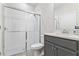 Modern bathroom featuring a glass-enclosed shower, sleek vanity, and neutral color palette at 15358 Arcadia Bluff Loop, Winter Garden, FL 34787