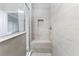 Bright bathroom showcasing tiled shower with built-in bench and niche for added convenience at 15358 Arcadia Bluff Loop, Winter Garden, FL 34787