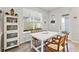 Charming dining area featuring wood accents, a large window, and access to the outdoor patio at 15358 Arcadia Bluff Loop, Winter Garden, FL 34787