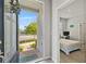 Inviting entryway with view to bedroom with a cozy bed and desk at 15358 Arcadia Bluff Loop, Winter Garden, FL 34787