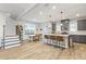 Open concept living area with kitchen featuring an island and barstool seating at 15358 Arcadia Bluff Loop, Winter Garden, FL 34787