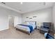 Serene bedroom with a tray ceiling, sitting area, and doorway leading to an en-suite bathroom at 15358 Arcadia Bluff Loop, Winter Garden, FL 34787