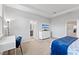 Spacious main bedroom featuring neutral tones, tray ceiling, and a doorway leading to the en-suite bathroom at 15358 Arcadia Bluff Loop, Winter Garden, FL 34787