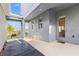 Covered outdoor patio with seating area, pavers, and views of the landscaped backyard at 15358 Arcadia Bluff Loop, Winter Garden, FL 34787