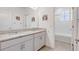 Bright bathroom with double vanity, granite countertops, and a separate toilet and shower area at 15378 Gilligan Ct, Winter Garden, FL 34787