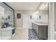 Bathroom showcasing a glass-enclosed shower, double sink vanity, and modern fixtures at 15378 Gilligan Ct, Winter Garden, FL 34787