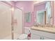 This bathroom features a vanity, granite countertop, and glass enclosed shower at 15378 Gilligan Ct, Winter Garden, FL 34787