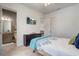 Cozy bedroom featuring a comfortable bed, dresser, and ensuite bathroom offering a private retreat at 15378 Gilligan Ct, Winter Garden, FL 34787