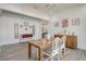 Dining room features wood flooring, a modern light fixture, and elegant decor, perfect for Gathering meals at 15378 Gilligan Ct, Winter Garden, FL 34787