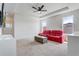 Bright living room featuring a coffered ceiling, ceiling fan and comfortable seating at 15378 Gilligan Ct, Winter Garden, FL 34787
