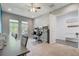 Bright office featuring a large window, ceiling fan and a work area with dual monitors at 15378 Gilligan Ct, Winter Garden, FL 34787