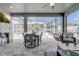 The screened patio featuring a dining area, seating and backyard views, making it ideal for relaxation and entertainment at 15378 Gilligan Ct, Winter Garden, FL 34787