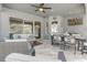 Relax on the screened patio with plush seating, ceiling fan, and backyard views; perfect for unwinding outdoors at 15378 Gilligan Ct, Winter Garden, FL 34787