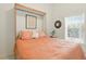 Inviting bedroom with a Murphy bed, complemented by bright window light and decor at 1548 Challenger Ave, Davenport, FL 33897