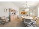 Dining room with carpeted flooring, with a decorative hutch for storage and display at 1548 Challenger Ave, Davenport, FL 33897