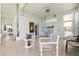 Inviting lanai with tile flooring, ceiling fan, and comfortable seating arrangements at 1548 Challenger Ave, Davenport, FL 33897