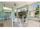 Screened lanai featuring tile floors, ceiling fan and views of the outdoors at 1548 Challenger Ave, Davenport, FL 33897