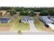 Real estate picture features a white single-Gathering home with a gray roof from a high-angle perspective at 16655 Sw 43Dr Terrrace Rd, Ocala, FL 34473