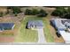 Aerial view of home situated on a landscaped lot with a long driveway at 16655 Sw 43Dr Terrrace Rd, Ocala, FL 34473