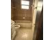 Small bathroom with a tub and shower combination, vanity, and tile flooring at 1675 Louis Dr, Kissimmee, FL 34758