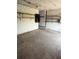 View of the garage interior, featuring shelves and ample storage space at 1675 Louis Dr, Kissimmee, FL 34758