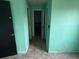 Hallway with tile floors connecting to other rooms in the home at 1675 Louis Dr, Kissimmee, FL 34758