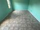 Turquoise room with tile floors and a single window at 1675 Louis Dr, Kissimmee, FL 34758