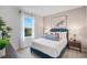 Bright bedroom with a blue bed frame, stylish furnishings, and carpet at 1830 Escobar Ave, Deltona, FL 32725