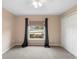 Neutral bedroom features large window, ceiling fan and a spacious closet at 2104 E Parkton Dr, Deltona, FL 32725