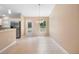 Bright dining area with tile floors, sliding glass door, and backyard view at 2104 E Parkton Dr, Deltona, FL 32725