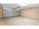 Spacious garage with large garage door and ample storage space at 2104 E Parkton Dr, Deltona, FL 32725
