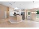 Modern kitchen with stainless steel appliances and eat-in bar and dining area at 2104 E Parkton Dr, Deltona, FL 32725
