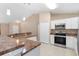 Bright open kitchen with stainless steel appliances and a view of the living area, perfect for entertaining at 2104 E Parkton Dr, Deltona, FL 32725