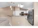 Modern kitchen featuring stainless steel appliances, breakfast bar, and ample counter space at 2104 E Parkton Dr, Deltona, FL 32725