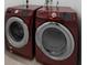 Close-up of laundry area featuring a matching red washer and dryer at 2104 E Parkton Dr, Deltona, FL 32725