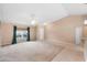 Bright open-concept living area with a vaulted ceiling and neutral color palette at 2104 E Parkton Dr, Deltona, FL 32725