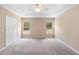 A generously sized main bedroom features a large closet and abundant natural light, perfect for relaxation at 2104 E Parkton Dr, Deltona, FL 32725