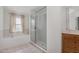 Bathroom featuring soaking tub and glass shower at 22619 State Road 44, Eustis, FL 32736
