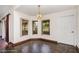 Bright dining area with multiple windows and elegant chandelier at 22619 State Road 44, Eustis, FL 32736