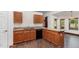 Spacious kitchen with granite countertops and wooden cabinets at 22619 State Road 44, Eustis, FL 32736