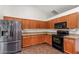 Well-lit kitchen featuring stainless steel refrigerator and modern appliances at 22619 State Road 44, Eustis, FL 32736