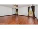 Open living room with hardwood floors and natural light at 22619 State Road 44, Eustis, FL 32736