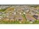 Aerial view showcasing the homes within the community, highlighting neighborhood layout at 228 Bergamot Loop, Davenport, FL 33837