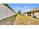 A spacious fenced-in backyard with healthy lawn space, ideal for outdoor enjoyment at 228 Bergamot Loop, Davenport, FL 33837
