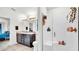 This bathroom features a double sink vanity and a glass enclosed shower at 228 Bergamot Loop, Davenport, FL 33837